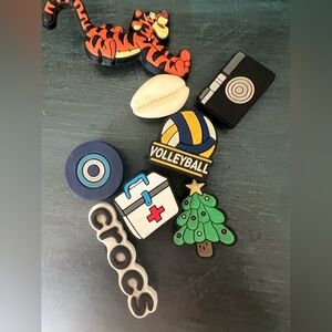 Jibbitz assorted 
CROCS, volleyball, Christmas tree, shell, medical, camera